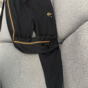 Nike Black Sweatpants with Gold Accents